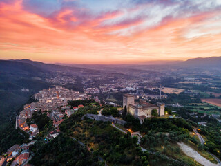 Cityscape of Narni at sunrise, with the fortress at the front and the old town beyond, Narni, Umbria