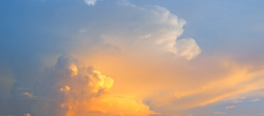 Naklejka na ściany i meble strong sunrise and cloud on the orange sky. Wide photo.