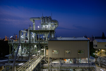 Manufacturing plant of chemical industrial with pipeline and pipe rack at twilight time