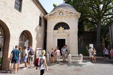 RAVENNA, ITALY - AUGUST 10, 2021: people visiting the tomb of Dante Alighieri Italian poet in...