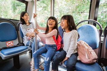 student going to school by bus public transportation together