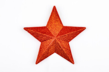 red glitter star isolated on a white background typical of the christmas tree