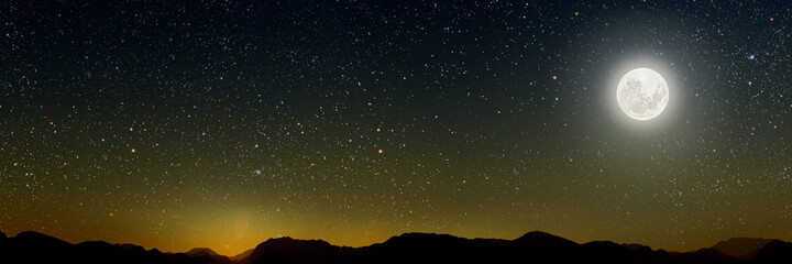 Naklejka na ściany i meble month on a background stars the sky shines over the mountains