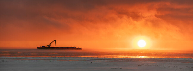 Beautiful sunset with fog in Arctic sea.