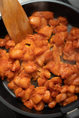 Frying chicked breasts close up