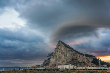 View from La Linea de La Concepcion to the Rock of Gibraltar and a dramatic storm sky above it
