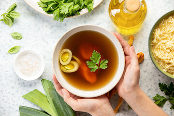 Bone broth in a bowl, top down view