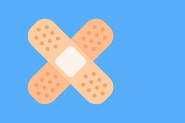 Isolated band aid or sticking plaster vector icon. Crossed adhesive bandage with copy space. Flat design illustration against blue background.