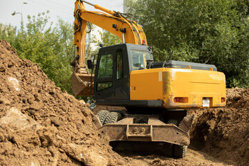 Construction machinery is digging a hole.