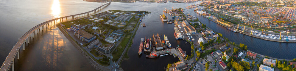 beautiful panorama of St. Petersburg and aerial view of cargo ship, cargo container in warehouse harbor in the Morskie Vorota district in St. Petersburg. - obrazy, fototapety, plakaty