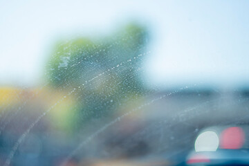 Car windshield with a period of water in a line