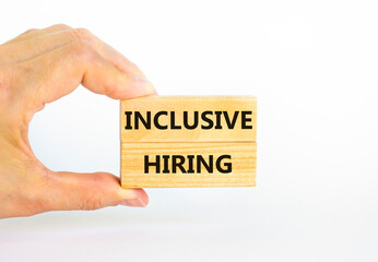 Inclusive hiring symbol. Wooden blocks with words Inclusive hiring on beautiful white background....