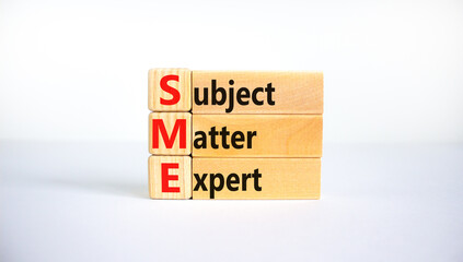 SME, subject matter expert symbol. Concept words SME, subject matter expert on wooden blocks on a...