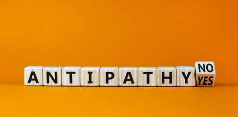 Antipathy yes or no symbol. Turned a wooden cube and changed words 'antipathy no' to 'antipathy...