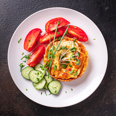 omelet vegetables fried eggs fresh breakfast salad tomato, cucumber fresh portion ready to eat meal snack on the table copy space food background veggie 