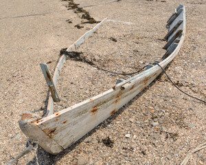 The shell of an old abandoned rowboat sits on the shoreline of Wills Gut on Baileys Island and the...