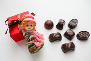 chocolates, gift box and a small figurine dolls 
