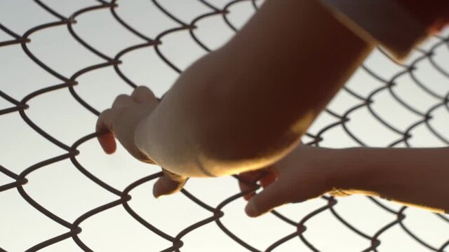 Child Hands Holding Steel Cage To Child Abduction 