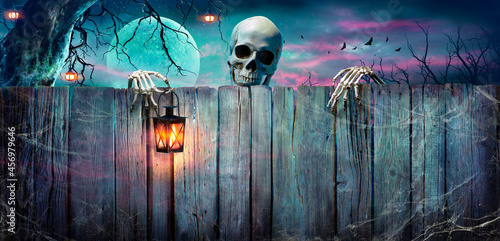 Halloween - Skeleton Holding Lantern On Wooden Banner In Night