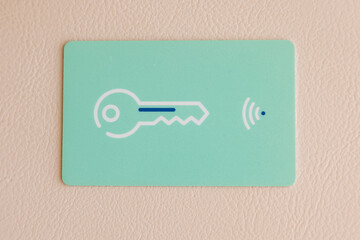 Top view of a hotel key card on a wooden table