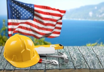 Happy Labor day concept. American flag with different construction tools