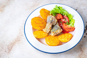 potatoes fried fish seafood fresh ready to eat meal snack on the table copy space food background rustic top view 