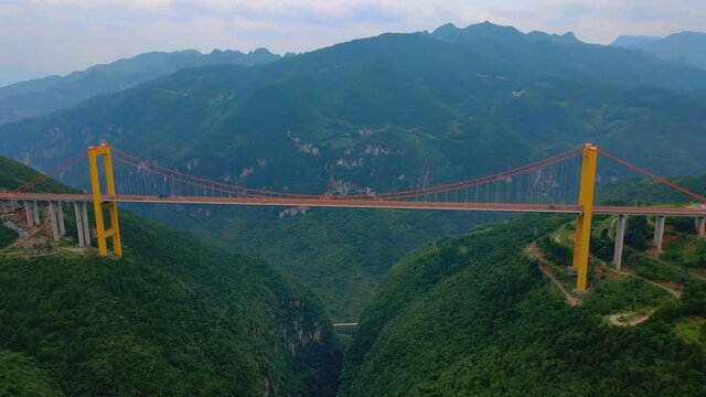 Puli Bridge or Pulihe Bridge is a bridge that crosses the Puli Canyon of the Gesiang River, located in the Qujing City District, China. (aerial photography)