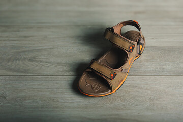 Indian Made Men's sandals on wooden table	
