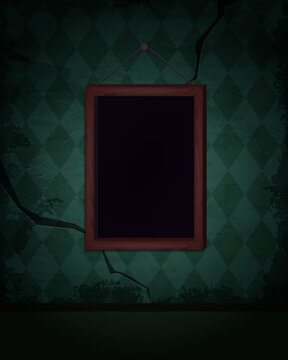 Aged old room with green grunge wallpaper and hanging empty picture frame