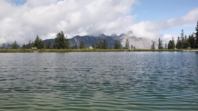 Windy Alpine Lake in Tyrol Nature. Kaltwassersee with Mountain View in Austria.
