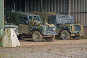 Fototapeta na wymiar British army Land Rover Wolf 4×4 military medium utility vehicles parked on a military exercise, Salisbury Plain UK