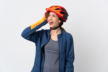 Young cyclist woman isolated on white background smiling a lot