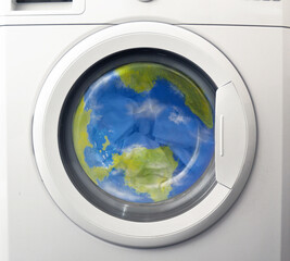 Planet earth globe inside a washing machine
(the planet earth globe is a physical model made and paint by hand and post production retouched by the photographer ) - 456984602