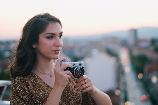 woman taking photo with camera