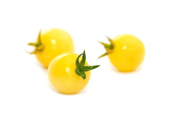 Yellow cherry tomatoes isolated on white