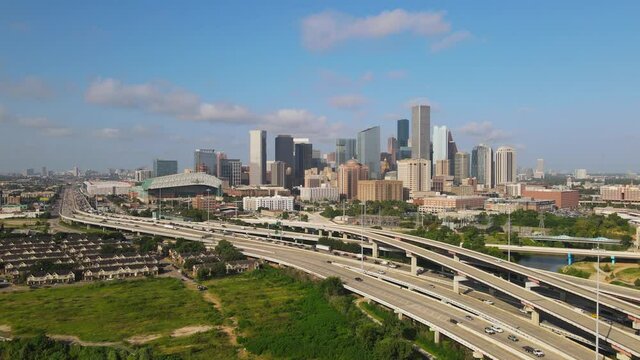 Rotating around highway interchange and Houston skyline
