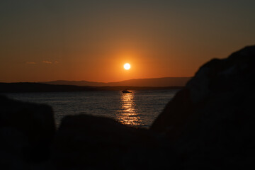 Boat in the glow of the setting sun.