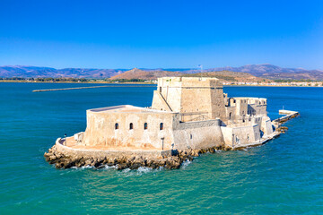 Fototapeta premium The Bourtzi water castle is a small island with a fortress at the coast of Nafplio in Greece