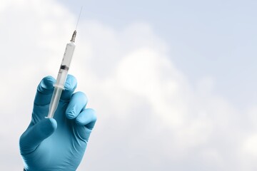covid-19 coronavirus vaccination concept with medical syringe