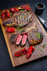 Rustic traditional barbecue dry aged wagyu t-bone and cote de boeuf beef steak with paprika and...