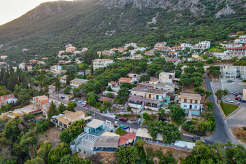 Aerial drone view over Mparmpati resort village, east of Corfu island, Greece.