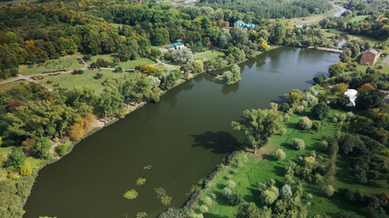 Fototapeta na wymiar City landscape. Nearby there is a park area. Aerial photography.