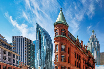 Fototapeta na wymiar Architecture contrast of the Gooderham building with the downtown district in Toronto Canada