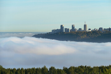 Fototapeta premium Morning fog in autumn over the city.