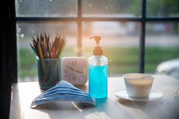 New Normal with Coronavirus Virus Protection concept.Alcohol gel and hygiene mask To quarantine from the covid-19.working space at home.