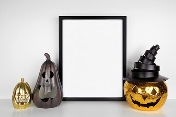 Halloween mock up. Black frame on a white shelf with jack o lantern candle holder decor. Portrait...