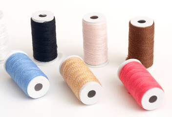 Colourful thread on a white background