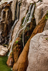 water trickling over tall rocks
