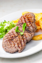 beef steak with homemade french fries and vegetable salad