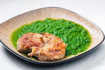 still life of pork cutlet with spinach
